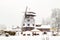 Farms and Farmhouses in the Snow. Windmill. Agriculture and Rural Life at Winter Background.