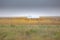 Farms and fields of Colorado, Kansas, Oklahoma, Missouri on a gloomy day with the grey sky