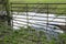 Farmyard gate with flooded field