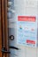 Faro, Portugal - March 16, 2020: Closed front door of the restaurant with coronavirus safety instructions leaflet in Portuguese