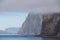 Faroe island misty cliffs