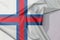 Faroe Islands fabric flag crepe and crease with white space.