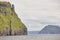 Faroe islands green landscape and atlantic ocean. Vagar