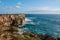 Farol de Sagres on the edge of the cliff washed by the big ocean waves