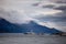 Farol Les Eclaireurs, a red and white striped lighthouse on rocky island on the Beagle Channel, Ushiaia, Argentina