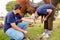 Farrier performing maintenance on old horseshoe for horse hoof