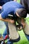 Farrier replacing horse shoe