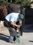 A farrier trimming a horse hoof.