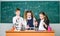 Fascinating chemistry. Basic chemical reactions. Group school pupils study chemistry in school. Boy and girls enjoy