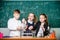 Fascinating chemistry. Group school pupils study chemistry in school. Boy and girls enjoy chemical experiment. Organic