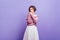 Fascinating european woman in soft knitted shirt posing with interest. Studio shot of refined young lady with elegant