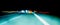 Fascinating mysterious beautiful abstract view of the night highway with lines of lights from cars