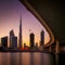 Fascinating reflection of tallest skyscrapers in Business Bay. Downtown summer day. Dubai, United Arab Emirates.