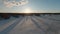 Fascinating speedy video from FPV drone backward fly over melting frozen lake. Many snow mobile traces on old ice. Northern Sweden