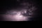 Fascinating view of the lightning gleaming in the purple cloudy sky - great for wallpapers