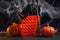 Fashion anti-stress sensory popit bubble popping toy. Halloween concept for kids. Orange pop it in a dark room next to