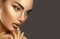 Fashion art makeup. Portrait of beauty woman with golden skin. Shiny professional makeup