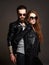 Fashion beautiful couple in sunglasses and leather