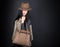 Fashion beautiful woman in country outfit, hat and bag