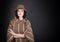 Fashion beautiful woman in country outfit and hat looking in camera