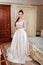 Fashion bride in gorgeous wedding dress studio portrait.