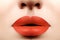 Fashion bright Makeup. Macro of Woman`s Face. Glamour lip Make-up with orange Lipstick. Plastic Surgery, Filler