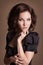 Fashion brunette woman with brown curly hair girl with perfect skin and makeup. Beauty Model retro