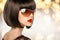 Fashion brunette woman in sunglasses. Black bob hairstyle. Red l