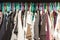 Fashion clothes on clothing rack - bright colorful closet.