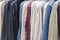 Fashion clothes on clothing rack - bright colorful closet.