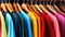 Fashion clothes on clothing rack - bright colorful closet.