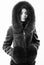 Fashion concept. Girl elegant lady wear fashionable coat jacket with furry hood. Luxurious fur. Girl posing hooded fur