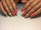 Fashion coral manicure with green leaf design on long nails
