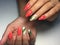Fashion coral manicure with green leaf design on long nails