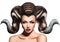 Fashion creative portrait of beautiful woman with horns in hair