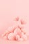 Fashion cute Valentine day stage in chinese style - soar pink paper hearts of fan on pastel pink color, copy space, vertical. Love