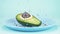 Fashion design food. half an avocado with a  pearls, glass ball, confetti