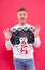 Fashion design for keeping festive. Happy man give OK sign in snowman jumper. Cold weather male style and fashion