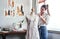 Fashion, design and woman with mannequin, measuring tape and sewing machine at creative small business. Focus