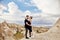 Fashion East couple hugging with mountains in background. Man and woman loving relationship. Beautiful mountains of Cappadocia