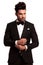 Fashion elegant man in tuxedo fixing his sleeve