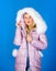 Fashion environmental awareness. Down jacket with furry hood. Girl wear winter jacket. Winter season. Soft fur. For