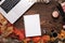 Fashion female accessories Set. autumn leaves, paper notebook and laptop