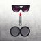 Fashion female set, black sunglasses, lipstick and little pocket mirror on textured silver