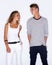 Fashion fever. Young trendy couple standing together on white background.