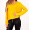 Fashion Forward: Confident Young Woman in Yellow Sweater and Black Leather Pants