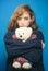 Fashion girl with glamour makeup hold toy bear. woman with fashion makeup and long curly hair. Fashion portrait of woman