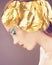 Fashion girl with golden decoration on the head, blue makeup