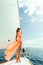 Fashion girl yachting in sea with blue sky sunlight