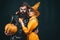 Fashion Glamour Halloween. Halloween sale and shopping. Portrait of happy young couple in Halloween with pumpkin.